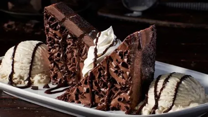 Decadent six-layer chocolate stampede cake served with vanilla bean ice cream
